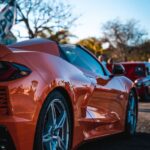 Luxury Cars - Orange sports car parked outdoors at a car meet  #11170813