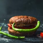 Food Aesthetics - Rustic bun with tomatoes and green peppers on da #13624263