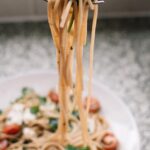 Food Aesthetics - Close-up of freshly cooked spaghetti with cherry #1373915