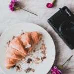 Food Aesthetics - Flat lay of a delicious croissant with a vintage #1393399