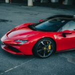 Luxury Cars - A dynamic shot of a vibrant red Ferrari SF90 Str #14317474