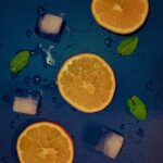 Food Aesthetics - Top view of orange slices, ice cubes, and mint l #16460763