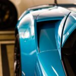Luxury Cars - Detailed close-up of a blue supercar with a spoi #17145731