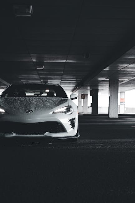 Luxury Cars - White sports car showcased in a dimly lit urban  #17793011