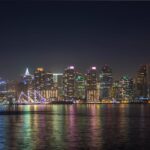 City Architecture - Vibrant nighttime cityscape with illuminated sky #18353682