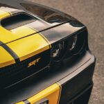 Luxury Cars - Close-up shot of a yellow and black Dodge Challe #22225487