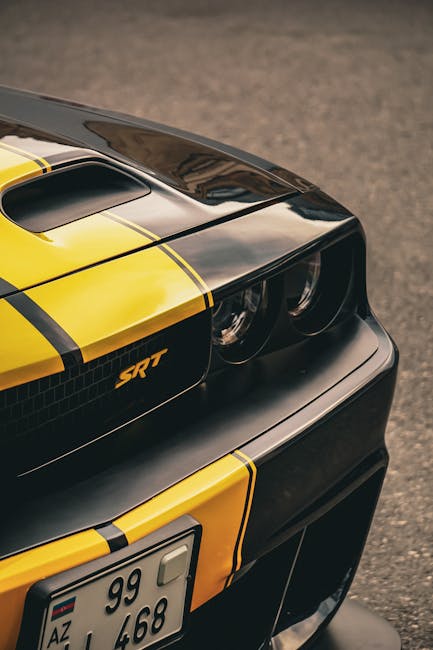 Luxury Cars - Close-up shot of a yellow and black Dodge Challe #22225487