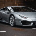 Luxury Cars - Sleek silver Lamborghini Huracan parked in city  #23124134