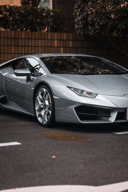 Luxury Cars - Sleek silver Lamborghini Huracan parked in city  #23124134