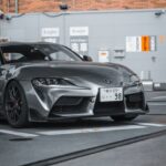 Luxury Cars - A modern gray Toyota Supra parked stylishly in a #23471333