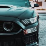 Luxury Cars - Dynamic front view of a sleek black sports car i #23507113