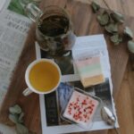 Food Aesthetics - A cozy tea setup with desserts on a wooden table #25328355
