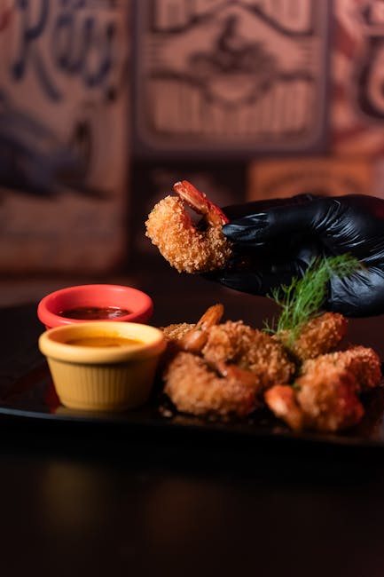 Food Aesthetics - Close-up shot of fried shrimp with sauces served #25672049