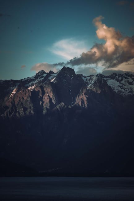 Mountain Landscapes - A breathtaking view of shadowed mountains under  #28352777