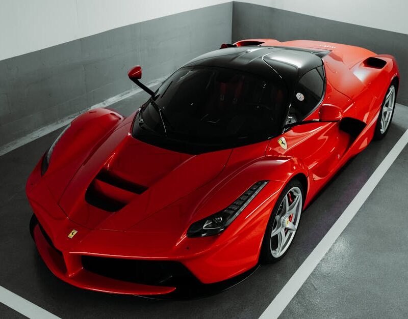 Luxury Cars - A stunning red Ferrari supercar parked indoors,  #28868891