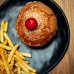 Food Aesthetics - Top view of a burger with a cherry on top served #28893500