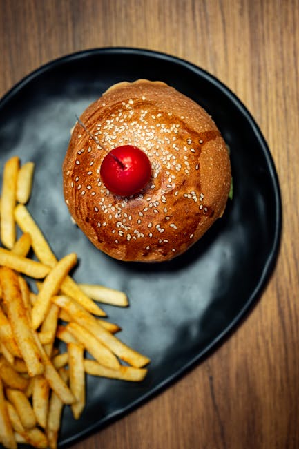 Food Aesthetics - Top view of a burger with a cherry on top served #28893500