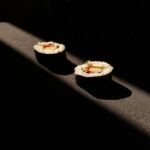 Food Aesthetics - Artistic shot of two sushi rolls under dramatic  #31263153