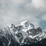 Mountain Landscapes - Majestic snow-covered mountain peaks under cloud #31299675