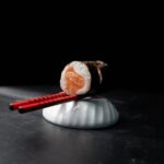 Food Aesthetics - Close-up of a sushi roll, delicately balanced on #31415299