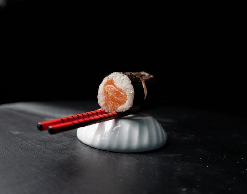 Food Aesthetics - Close-up of a sushi roll, delicately balanced on #31415299
