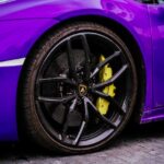 Luxury Cars - Detailed view of purple luxury sports car wheel  #32364025