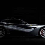 Luxury Cars - Side profile of a luxury sports car against a da #33345481