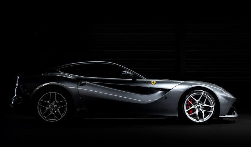 Luxury Cars - Side profile of a luxury sports car against a da #33345481