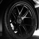 Luxury Cars - Black and white close-up of a sleek sports car w #34285245