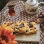 Food Aesthetics - A warm, cozy indoor setup featuring tea, homemad #34581357