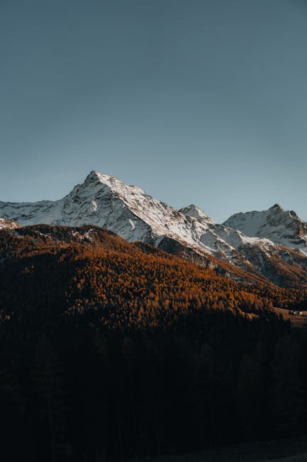 Mountain Landscapes - A stunning view of a snow-capped mountain with a #35116865