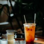 Food Aesthetics - Chilled iced tea beside a smaller drink on a sun #35137083