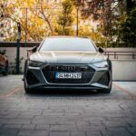 Luxury Cars - Front view of a sleek luxury car in an urban out #35252958