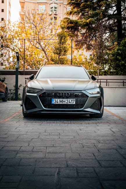 Luxury Cars - Front view of a sleek luxury car in an urban out #35252958