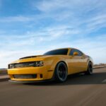 Luxury Cars - Dynamic shot of a yellow sports car speeding on  #35379138