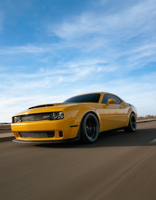 Luxury Cars - Dynamic shot of a yellow sports car speeding on  #35379138