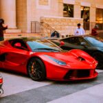 Luxury Cars - A lineup of luxury sports cars parked on an urba #7537128