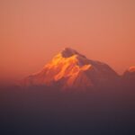 Mountain Landscapes - Snow-capped Himalayan peak glowing in the warm h #7719325