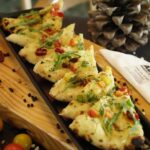 Food Aesthetics - Mouth-watering flatbread slices garnished with f #8414643