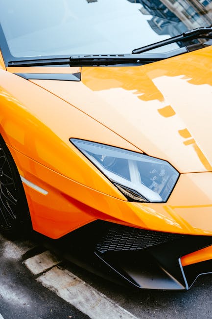 Luxury Cars - Close-up view of an orange Lamborghini Aventador #9322195